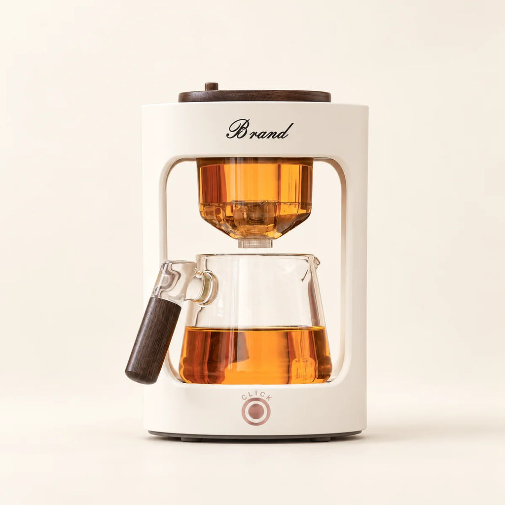 Automatic Glass Tea Maker with Keep-Warm on a warm ivory studio background