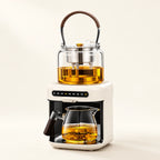 Automatic Steam Teapot on a warm ivory studio background