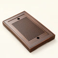 Bamboo Tea Tray with Storage on a warm ivory studio background