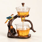 Bird Glass Tea Brewer on a warm ivory studio background