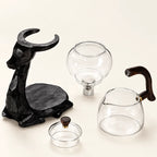Black Elk Glass Tea Set on a warm ivory studio background