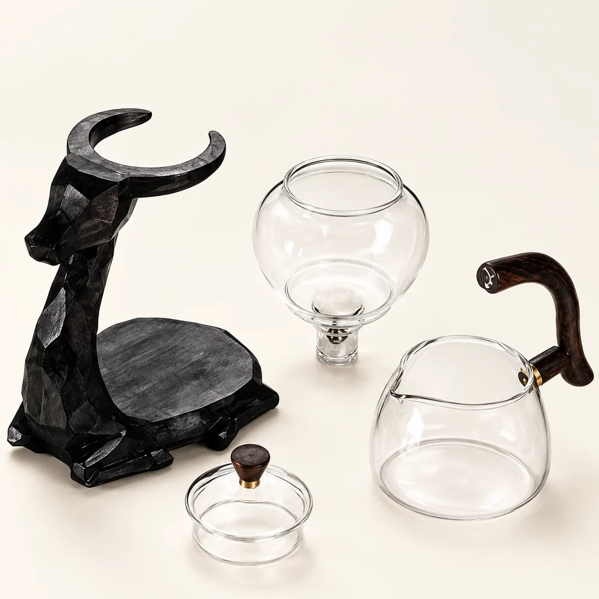 Black Elk Glass Tea Set on a warm ivory studio background