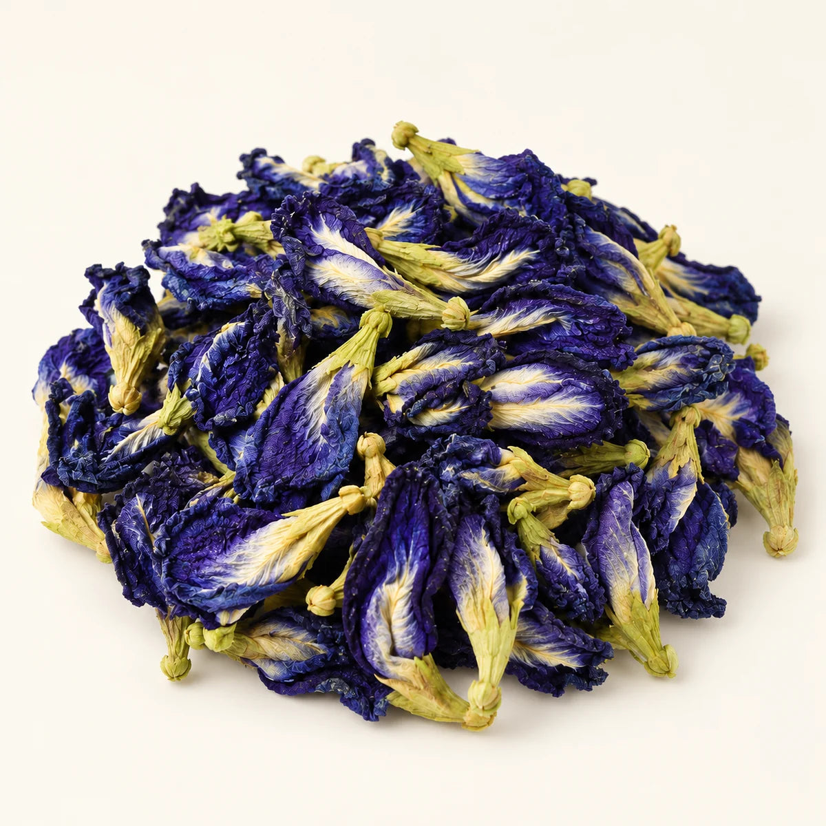 Butterfly Pea Flowers — 50g on a warm ivory studio background