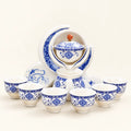 Ceramic Moon Teapot Set on a warm ivory studio background