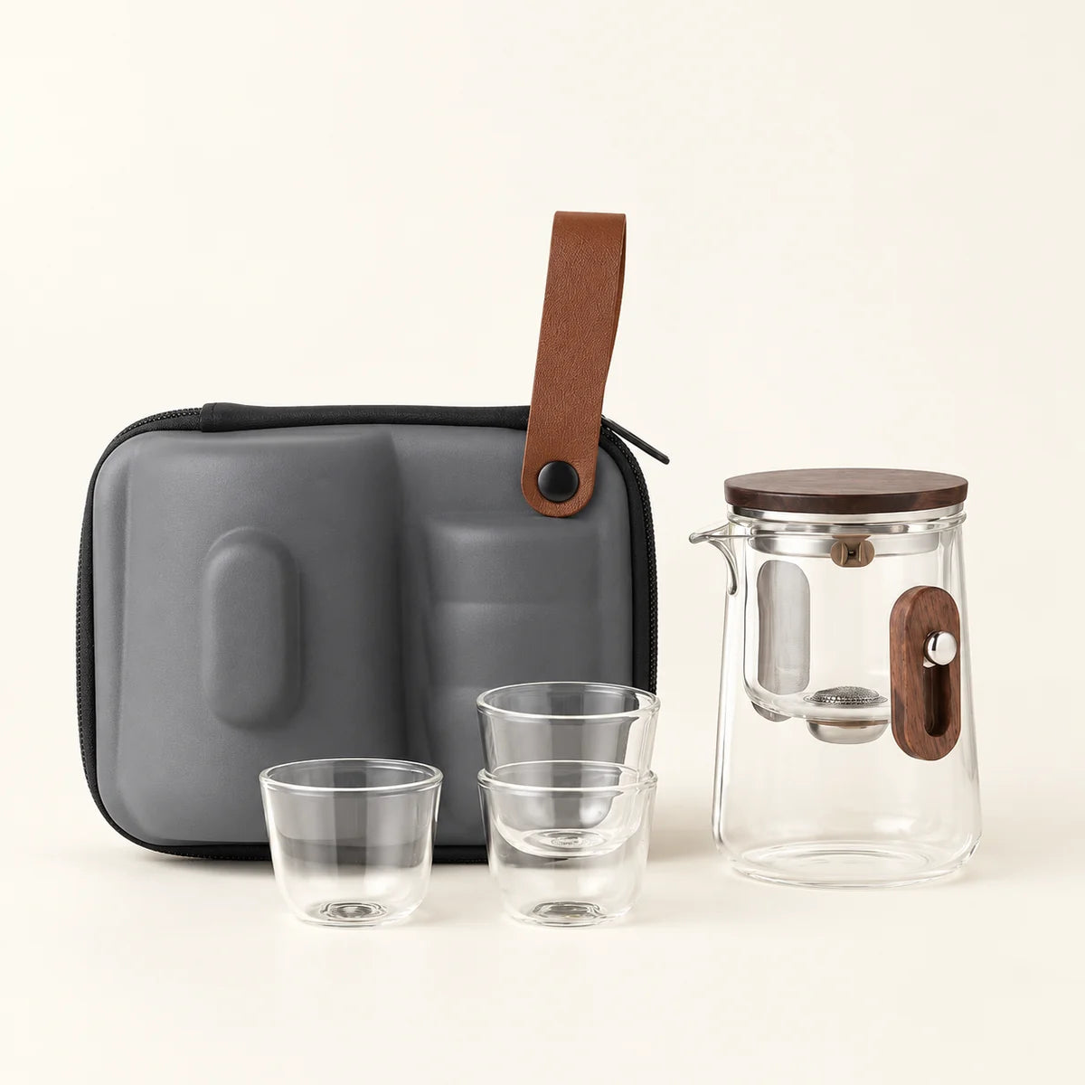 Compact Glass Tea Infuser on a warm ivory studio background