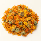 Dried Calendula Flowers — 50g on a warm ivory studio background