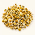 Dried Chamomile Flowers — 50g on a warm ivory studio background
