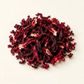 Dried Hibiscus Flowers — 50g on a warm ivory studio background