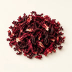 Dried Hibiscus Flowers — 50g on a warm ivory studio background