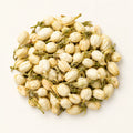 Dried Jasmine Flowers — 50g on a warm ivory studio background