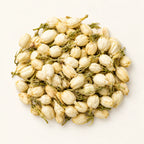 Dried Jasmine Flowers — 50g on a warm ivory studio background
