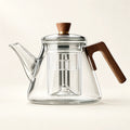 Glass Boiling Teapot — 1000ml on a warm ivory studio background