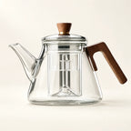 Glass Boiling Teapot — 1000ml on a warm ivory studio background