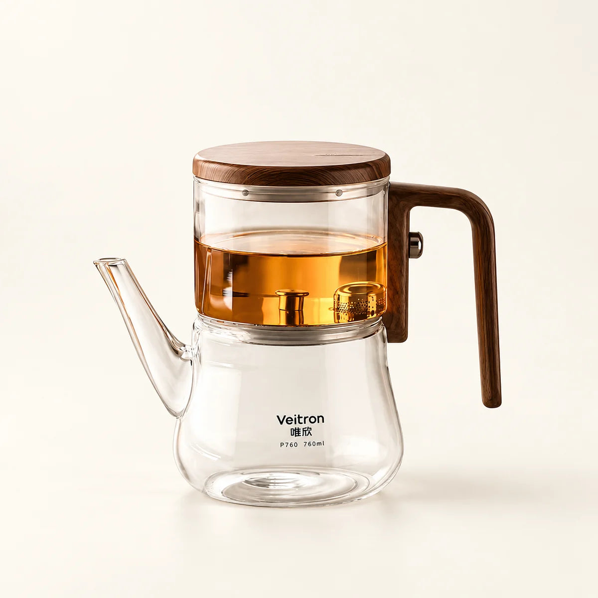 Glass Infuser Teapot with Wood Handle on a warm ivory studio background