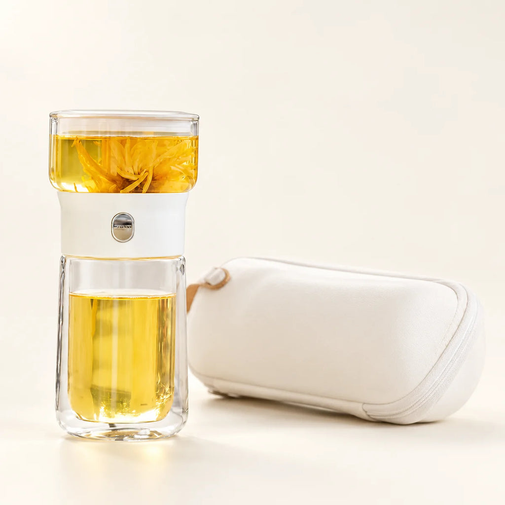 Glass Tea Infuser Bottle — Black / White on a warm ivory studio background