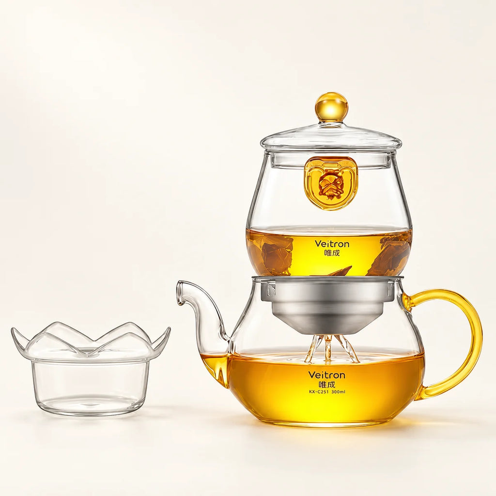 Glass Teapot with Filter on a warm ivory studio background