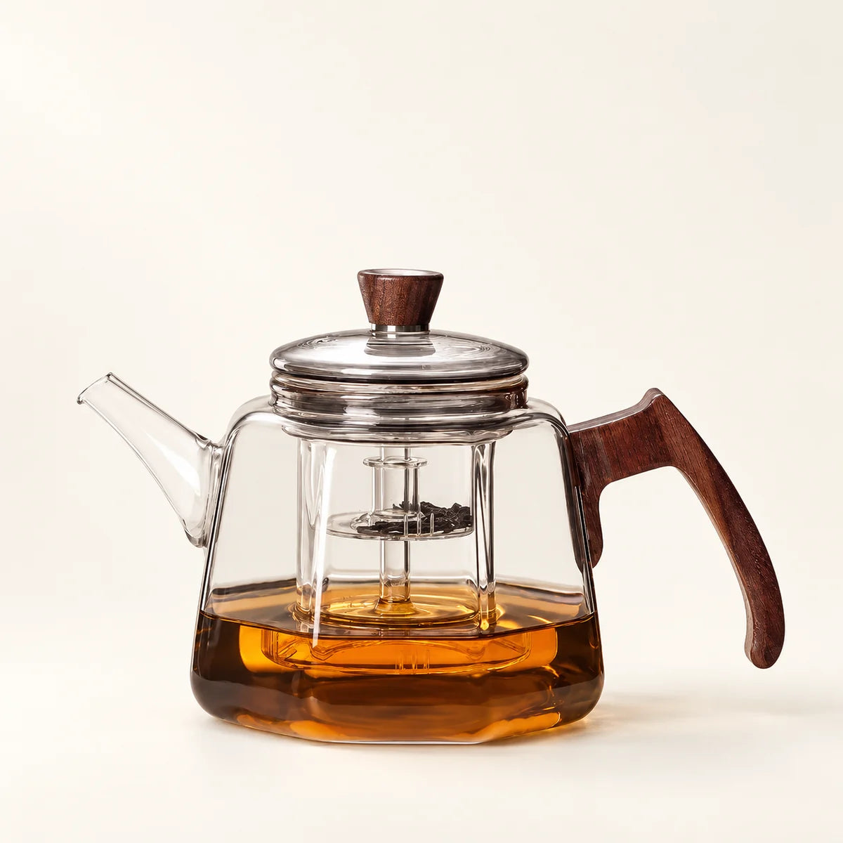 Heat-Resistant Glass Tea Kettle on a warm ivory studio background