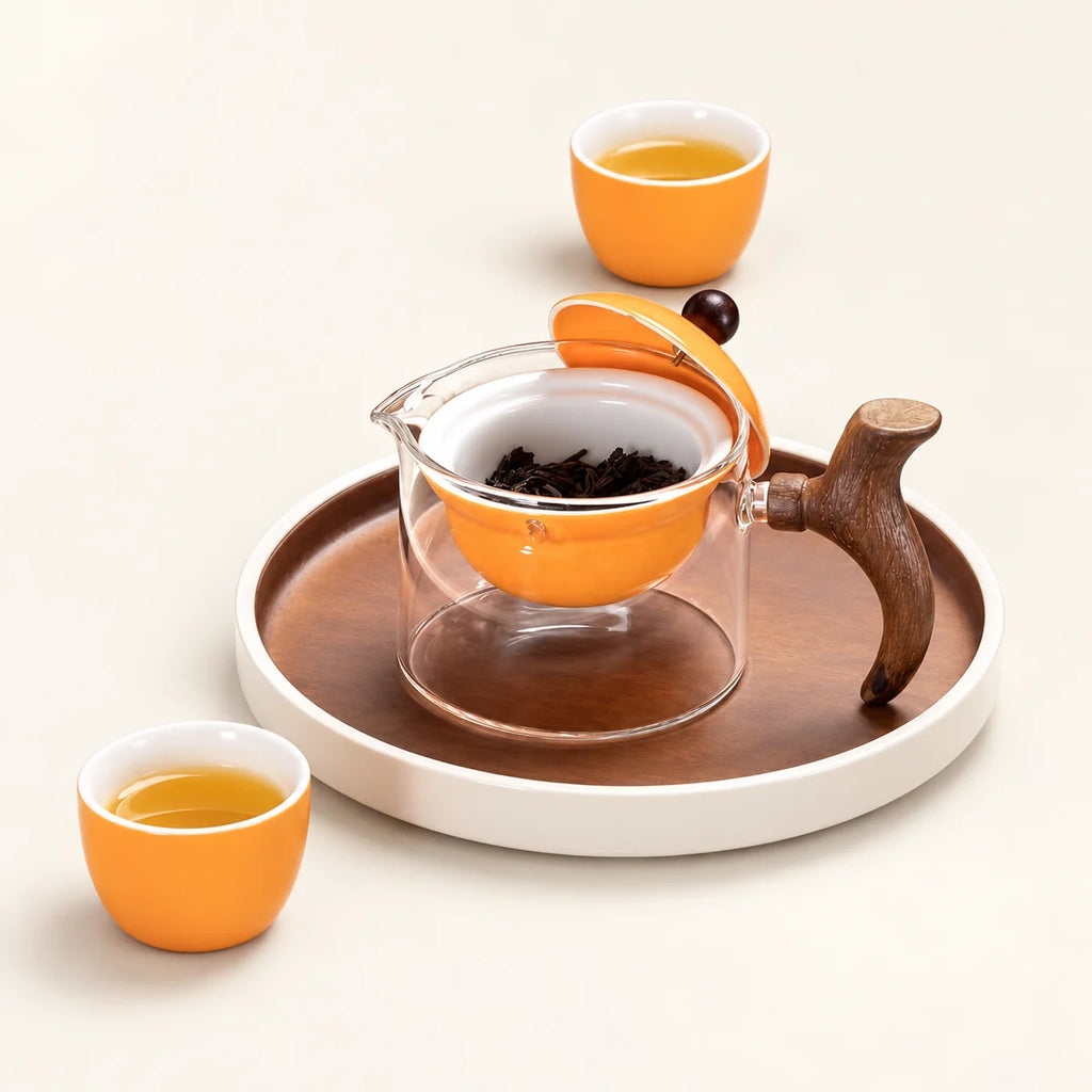 Justice Glass Tea Infuser on a warm ivory studio background