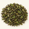 Moroccan Mint Green Tea — 3 oz on a warm ivory studio background