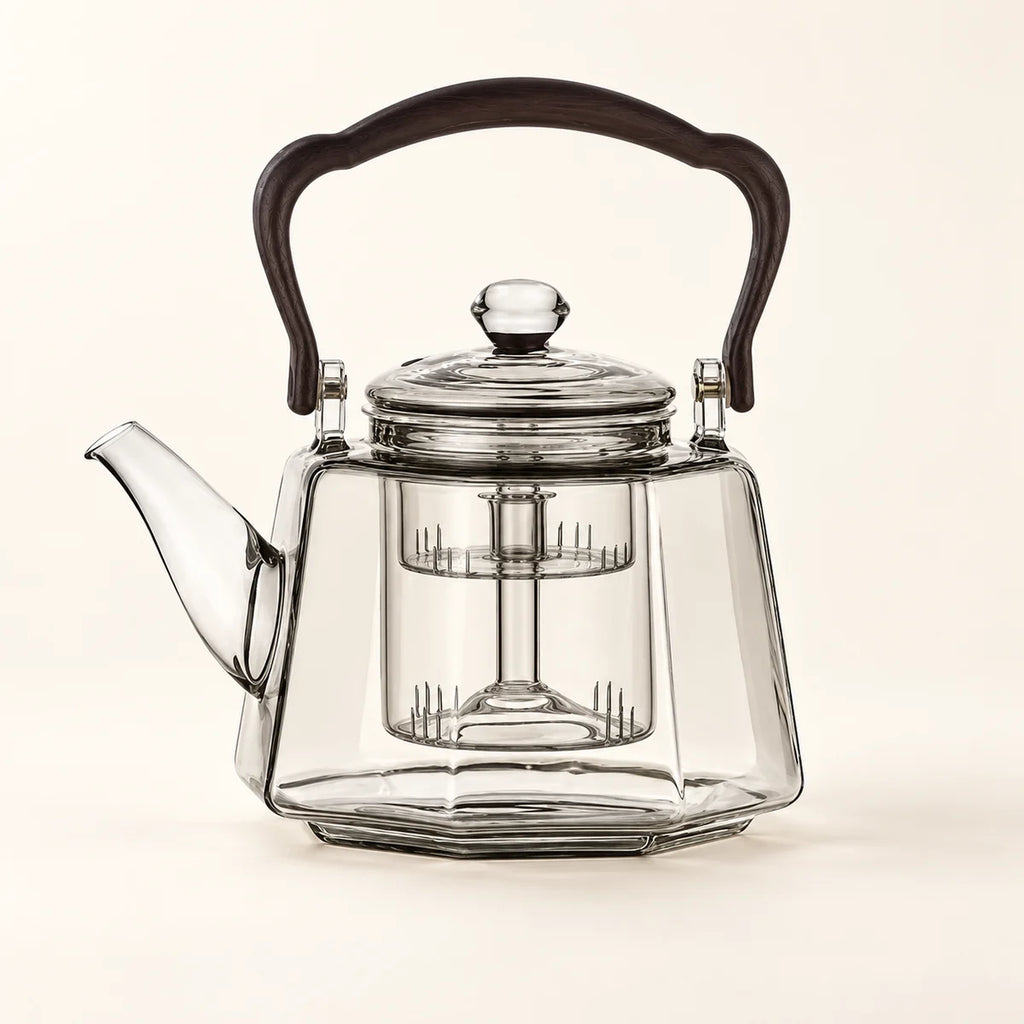 Octagonal Glass Tea Kettle on a warm ivory studio background