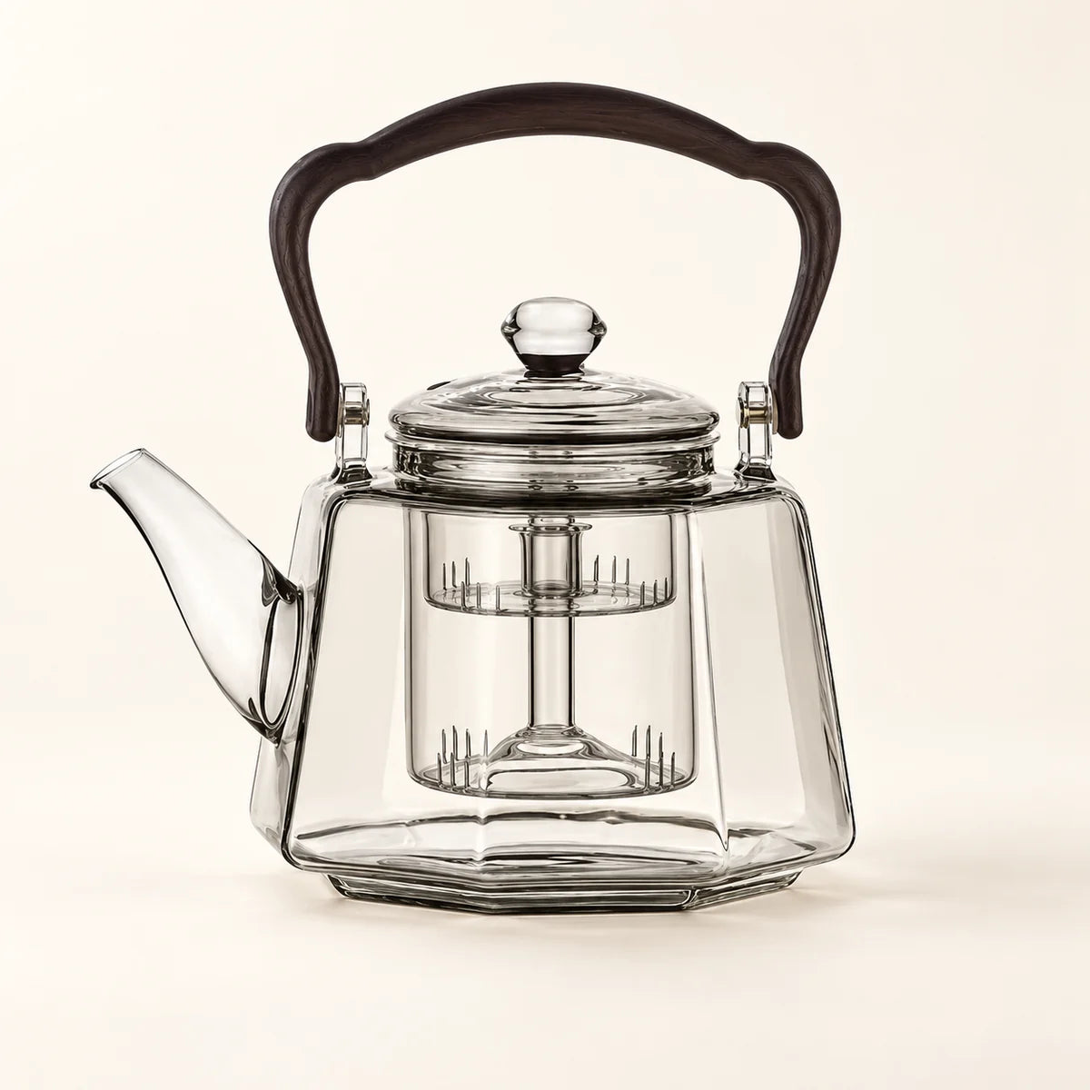 Octagonal Glass Tea Kettle on a warm ivory studio background
