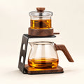 One-Touch Magnetic Tea Maker on a warm ivory studio background