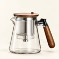 Press-Button Glass Tea Infuser on a warm ivory studio background