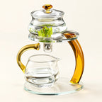 Amber Glass Gongfu Tea Brewer on a warm ivory studio background