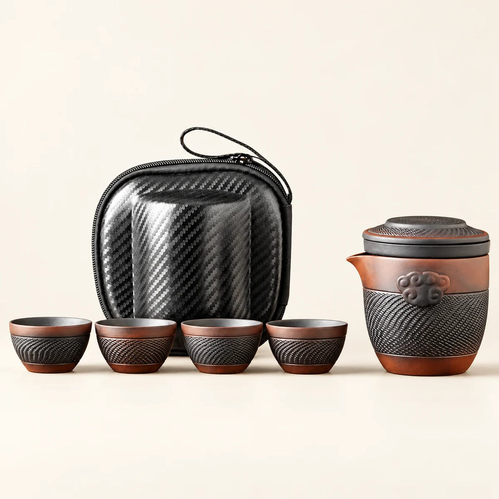 Travel Tea Set — 1 Pot, 4 Cups on a warm ivory studio background